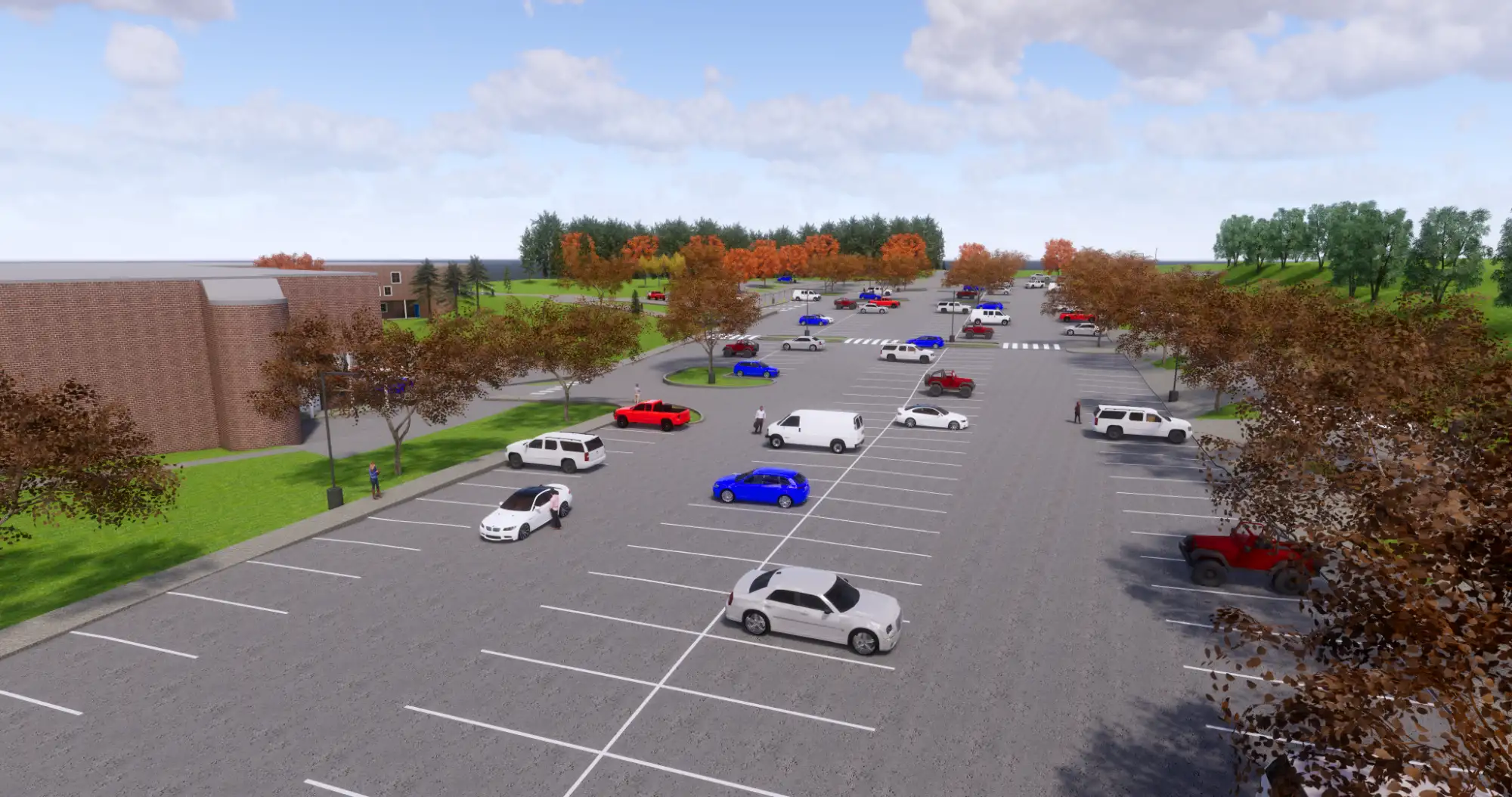 LEWISTON HIGH SCHOOL BUILDING EXPANSION & IMPROVEMENTS 3 - Sebago Technics Large parking lot with scattered parked cars, bordered by trees with autumn leaves, and a brick building on the left under a partly cloudy sky.