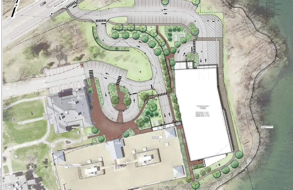 trio-img-3 - Sebago Technics Architectural site plan by a Maine engineering firm featuring roads, parking lots, pathways, landscaped areas, and buildings adjacent to a waterfront on the right side.